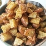 roasted potatoes, seasoned with za'atar, in a bowl.