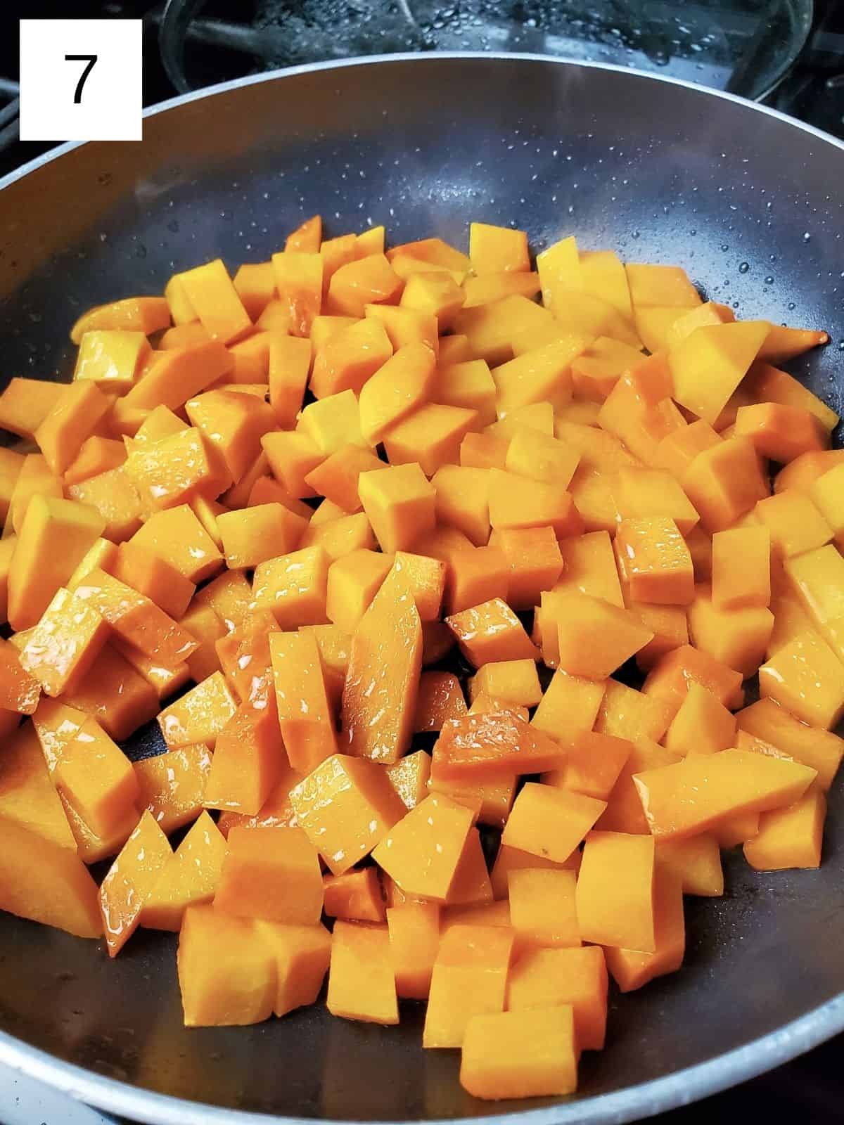 soften butternut squash cubes on a heated pan.