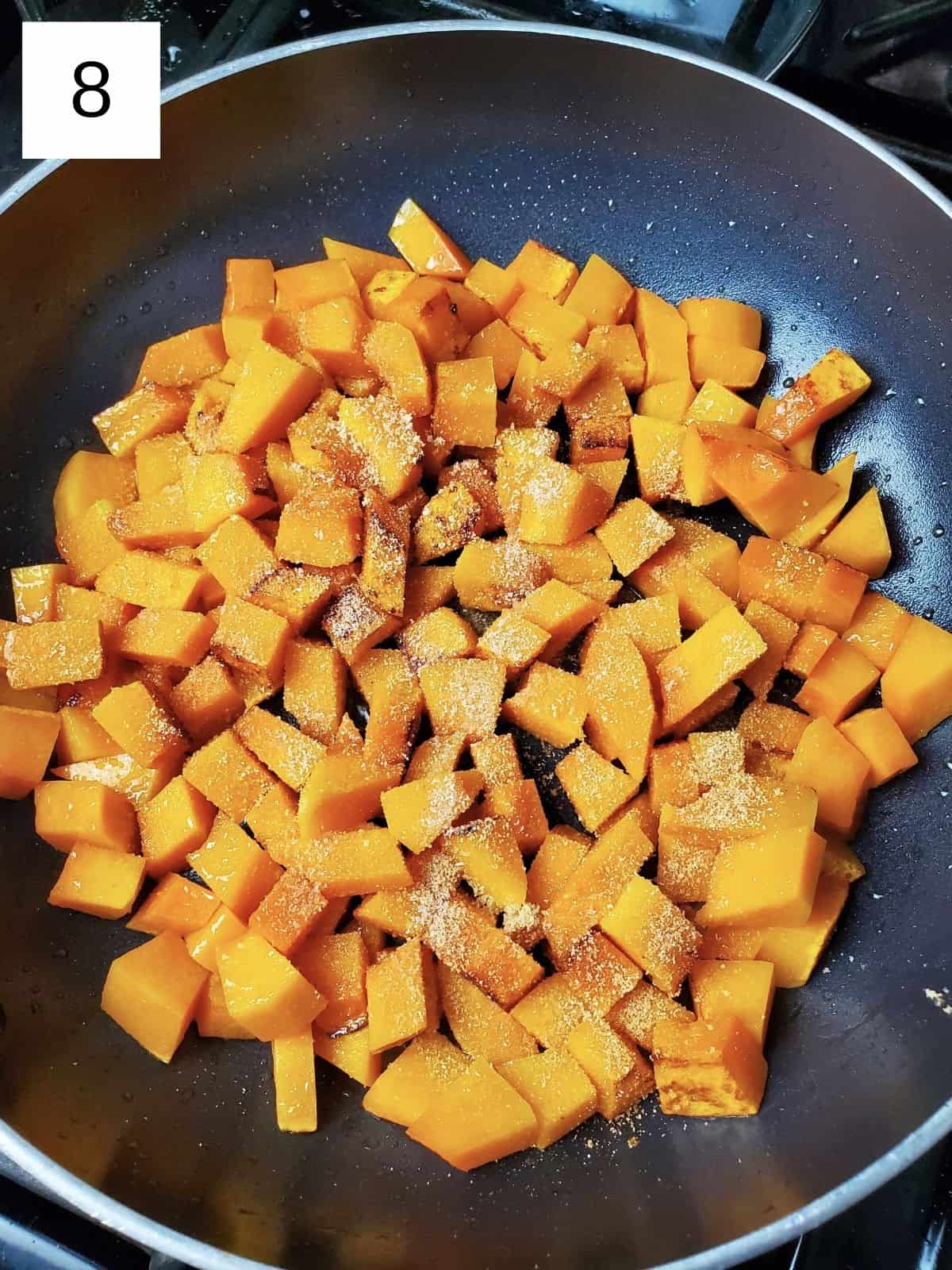 soften butternut squash cubes, sprinkled with garlic powder and salt, on a heated pan.