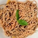 a plate of spaghetti pasta with garlic herb tahini sauce.