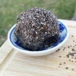 ginger tahini protein ball, coated with chia seeds.