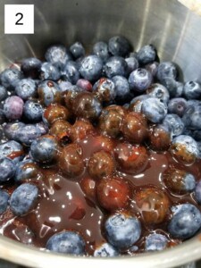 blueberries with date syrup on a heated saucepan.