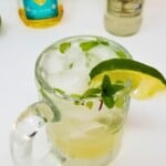 a glass of ice-cold virgin moscow mule mocktail topped with a slice of fresh lime fruit.