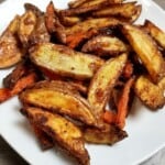 air fried potatoes and carrots, seasoned with maple garlic, in a plate.