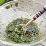 salad dressing with tulsi and sage in a glass bowl.