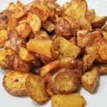 roasted turmeric potatoes in a plate.