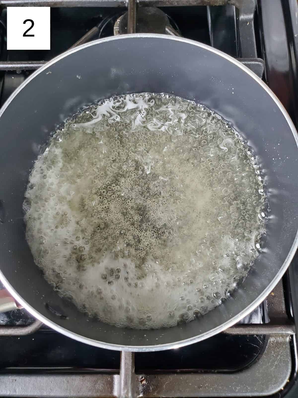 a boiling saucepan of sugar and water mixture.