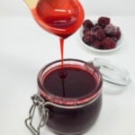 blackberry simple syrup in a glass container.