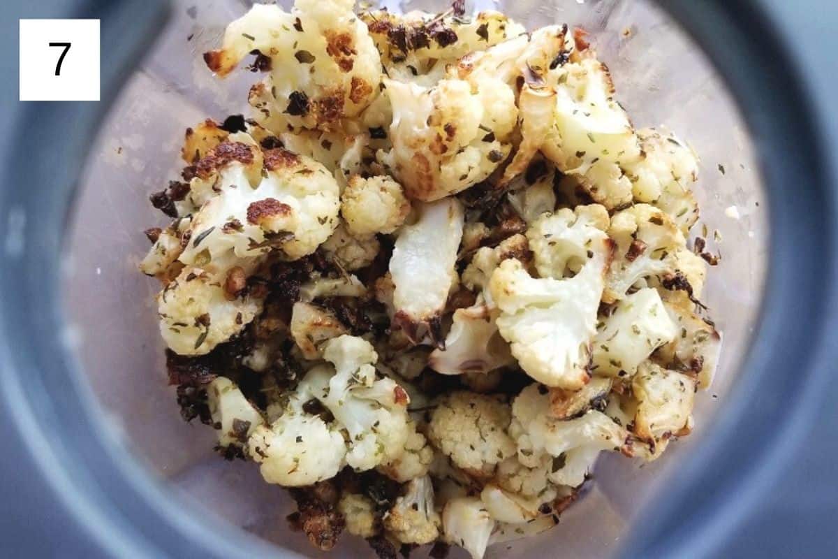 Roasted cauliflower florets in a glass bowl.
