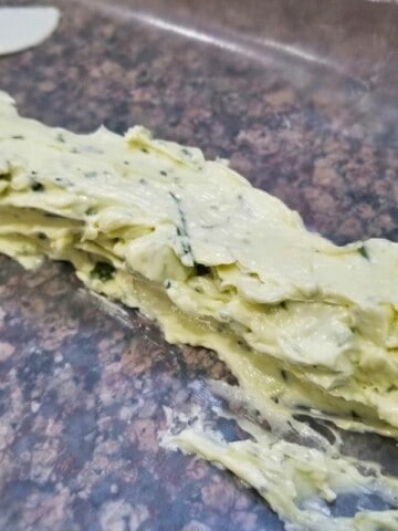 Garlic herb compound butter being made.