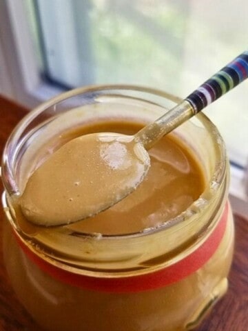 toasted macadamia nut butter in a glass jar.