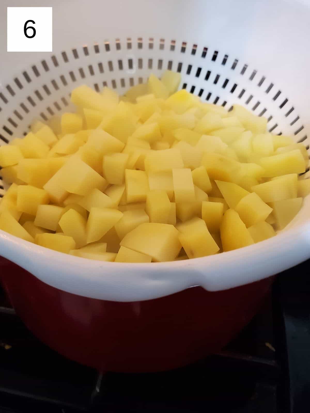 boiled potato cubes in a coriander.