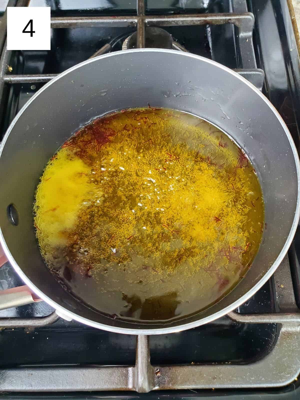 saffron syrup mixture in a pan.