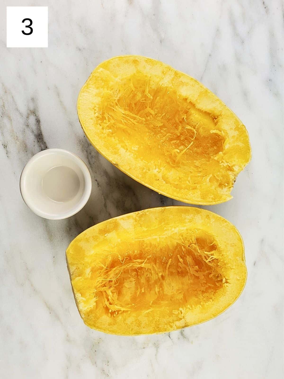 spaghetti squash with seeds removed, lightly coated in oil.