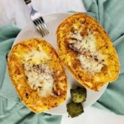 roasted seasoned spaghetti squash halves topped with melted mozzarella cheese.
