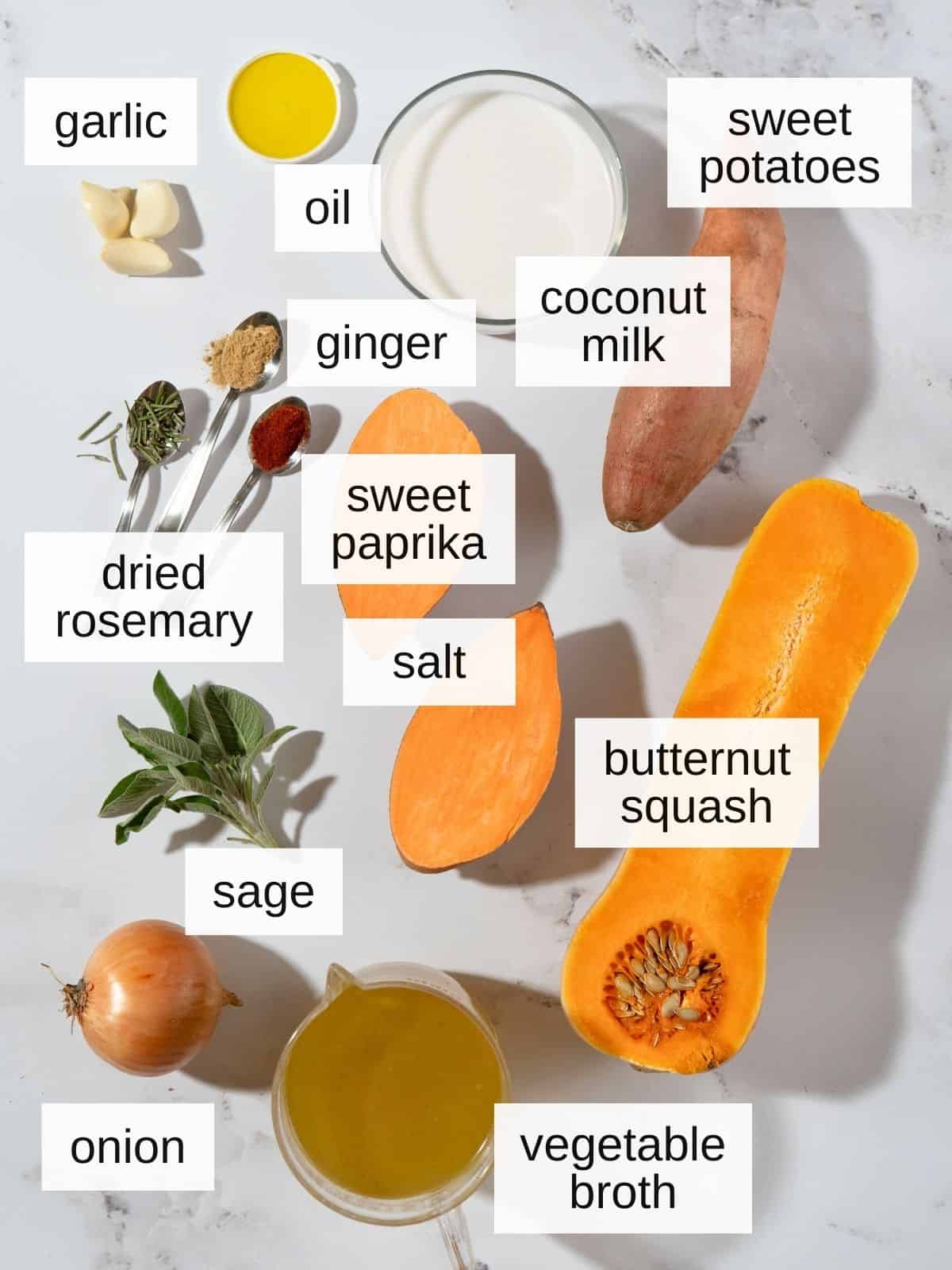 ingredients for butternut squash sweet potato soup including garlic, oil, ginger, sweet paprika, coconut milk, dried rosemary, salt, sage, onion, vegetable broth, butternut squash and sweet potatoes.