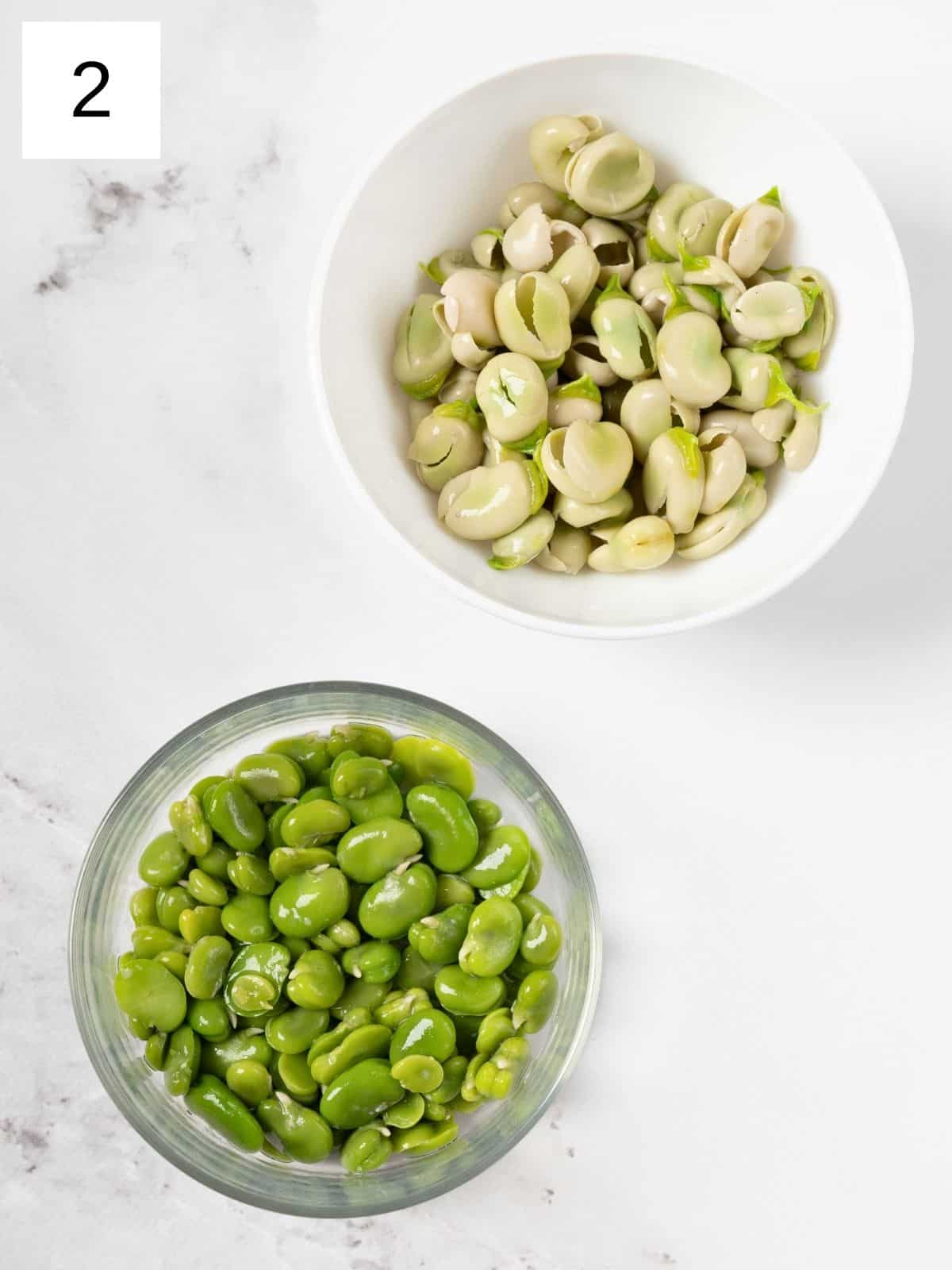 two separate bowls of fava beans and their pods.