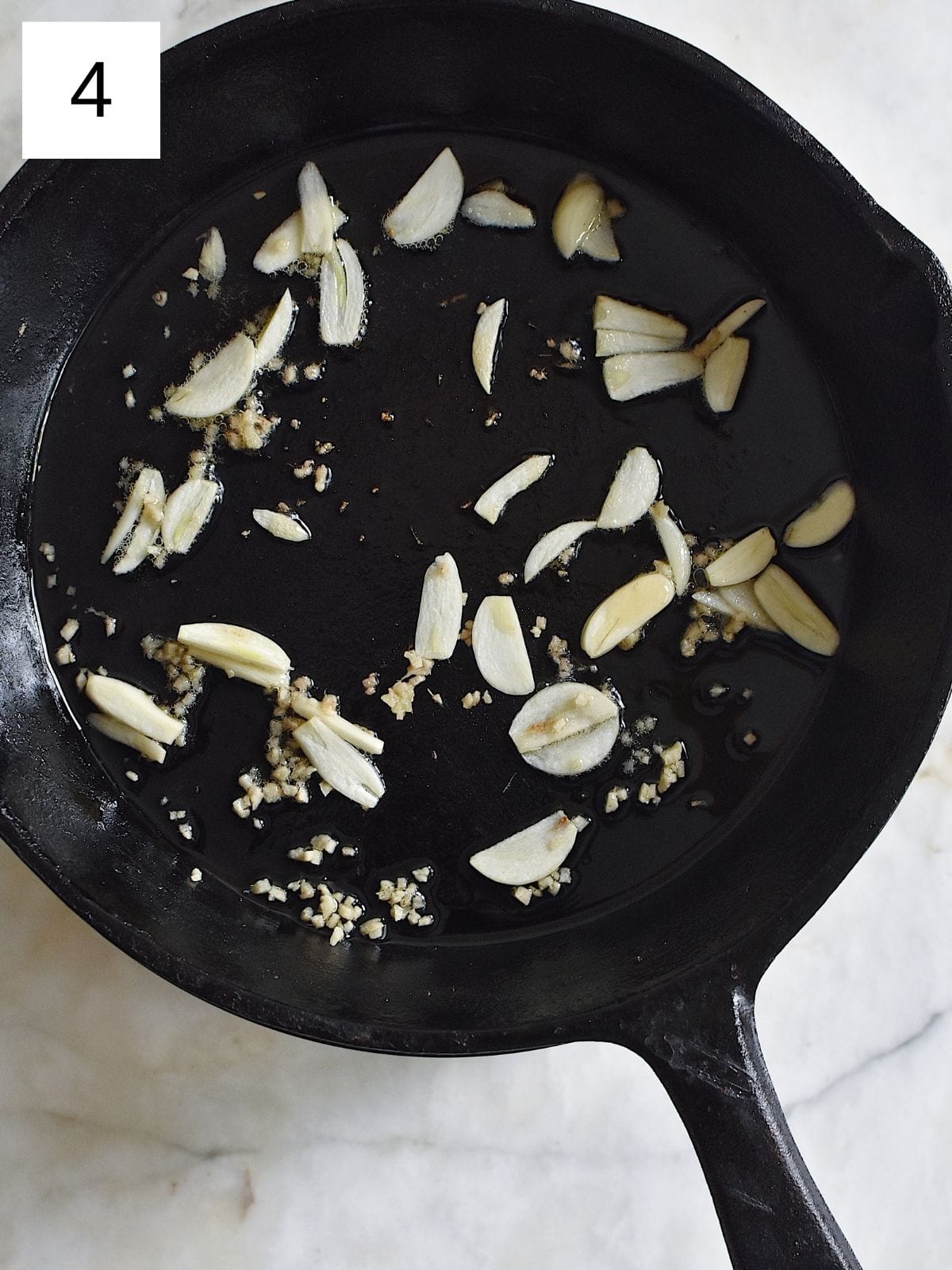 sautéing chopped garlic and ginger in an oil-coated cast iron.