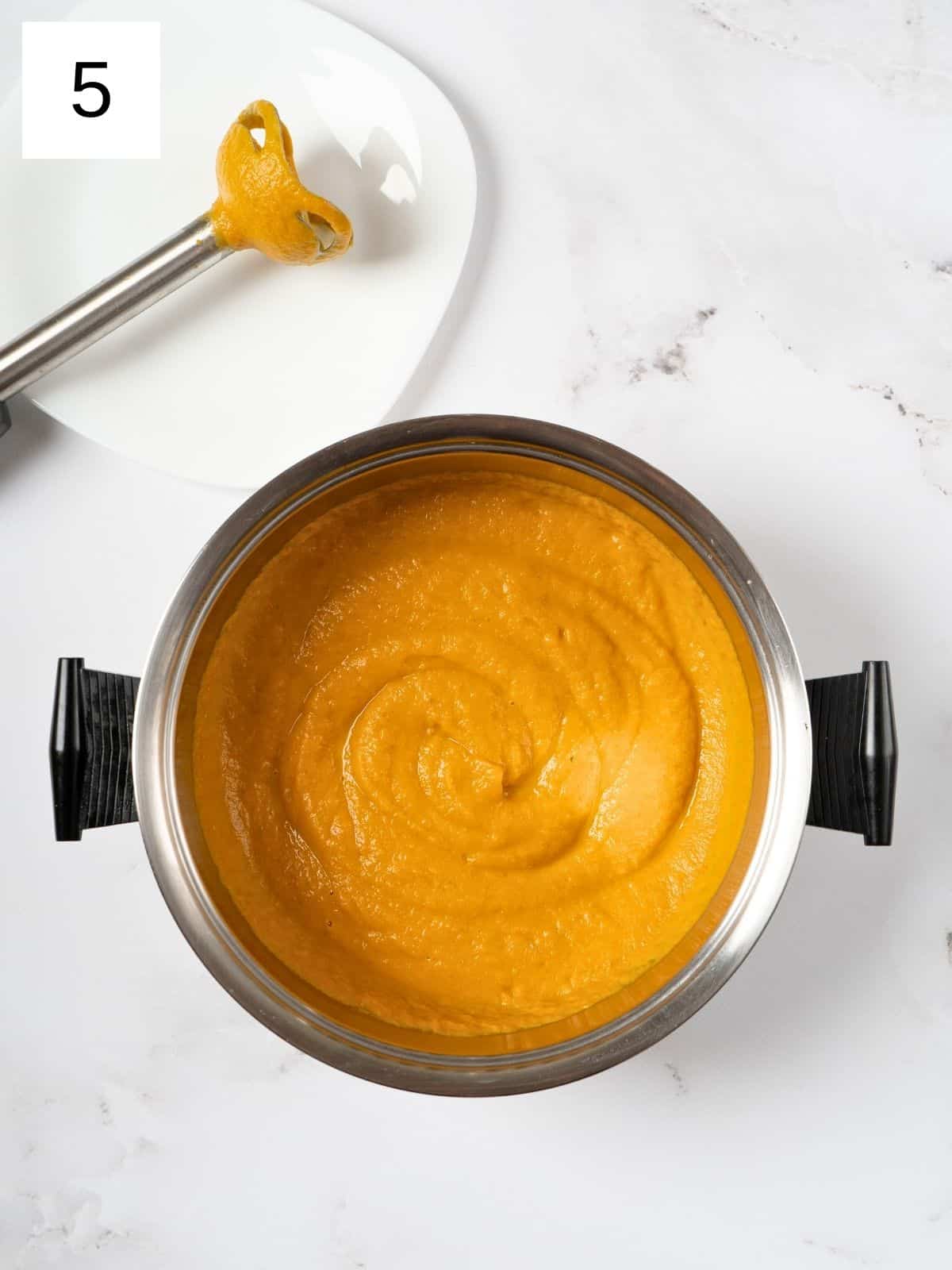 blended sweet potato and carrot soup using an immersion blender.