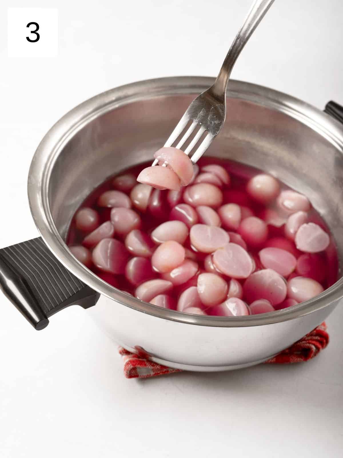 tender radish halves in a pot of simmered water.