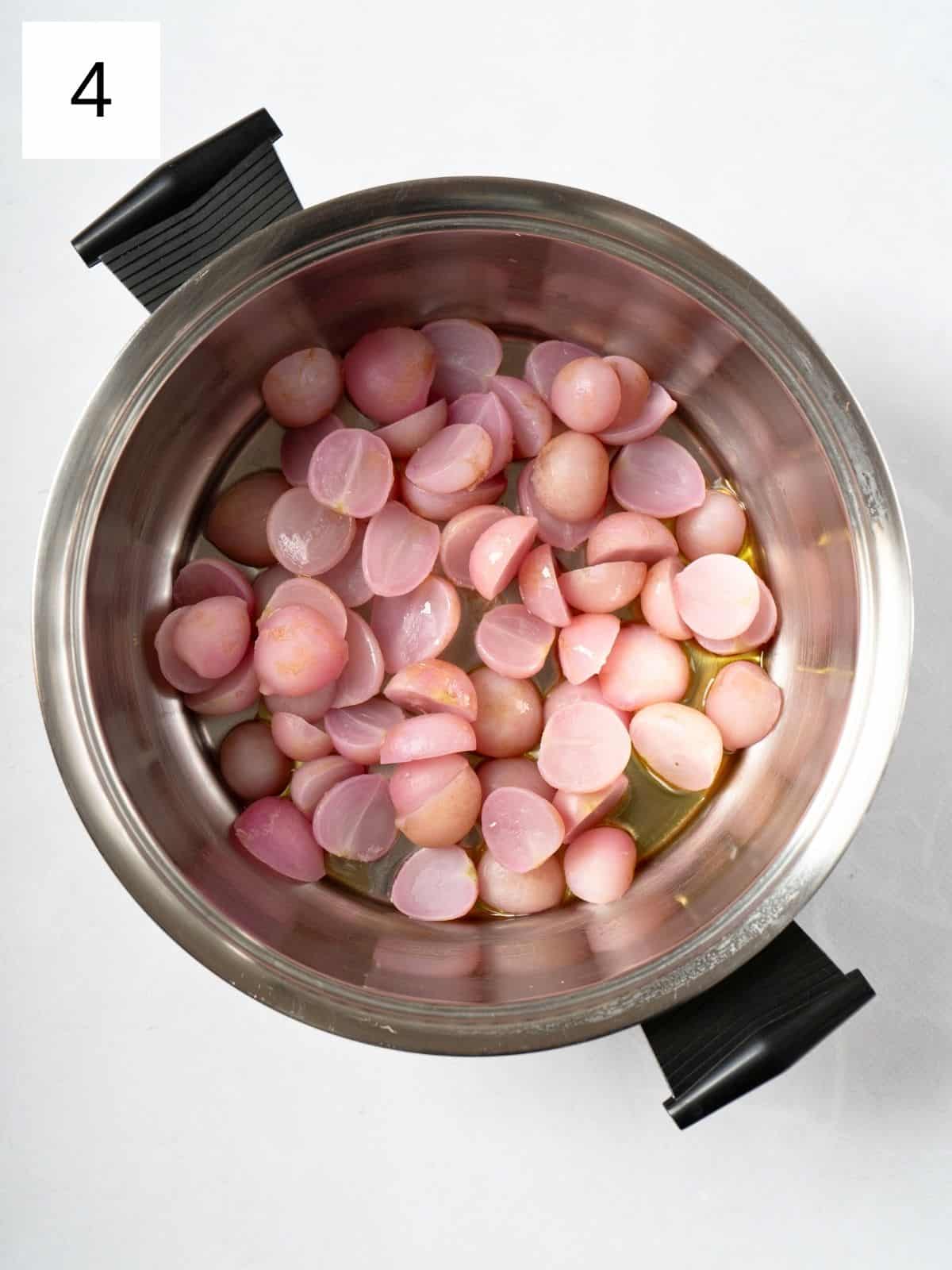 softened radish halves with oil in a pot.