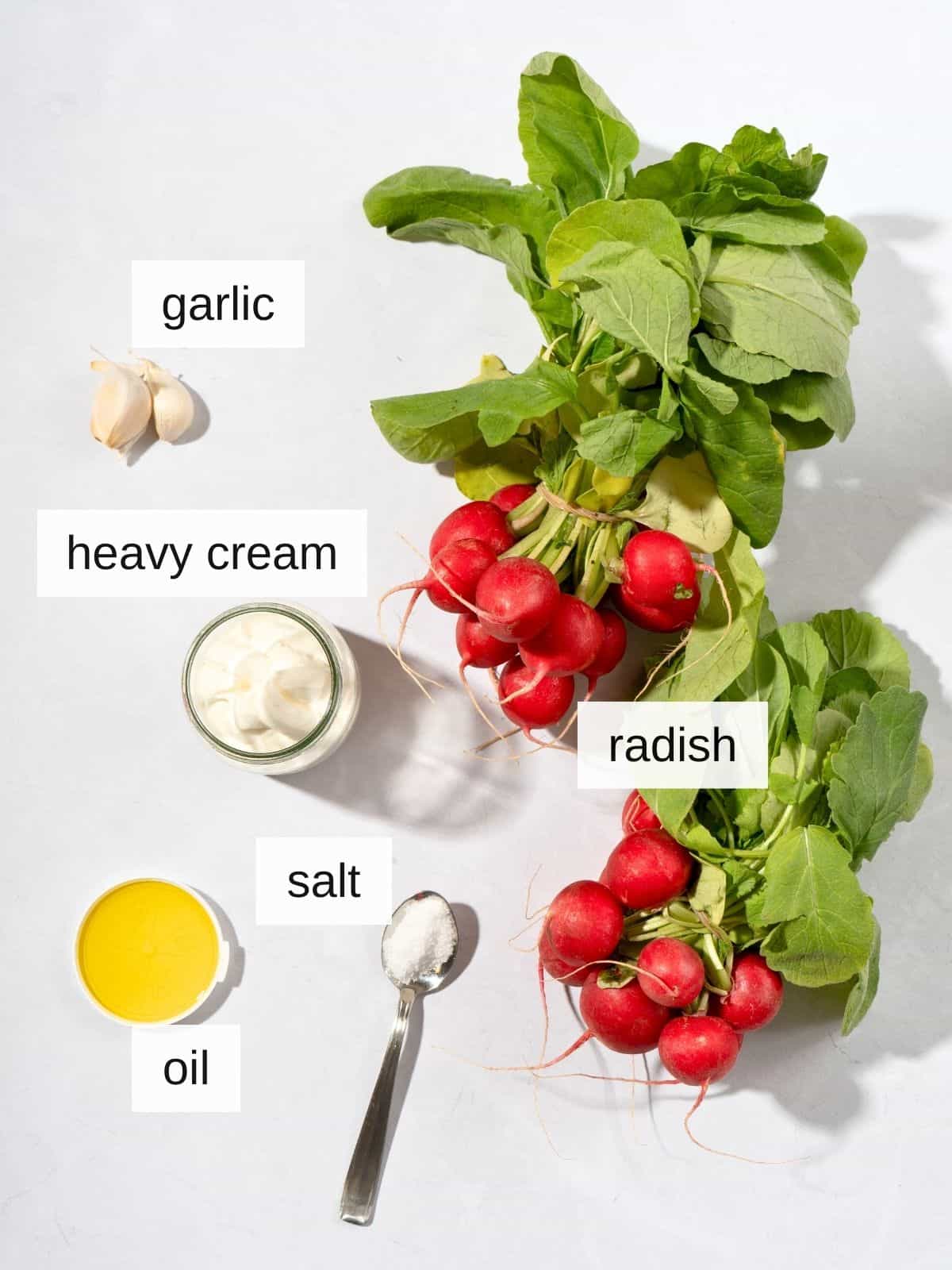 ingredients for mashed radish recipe, including garlic, heavy cream, salt, oil or butter, and radish.