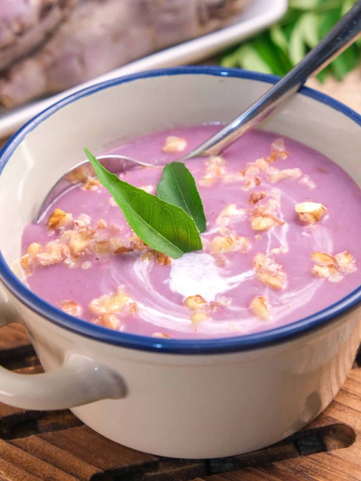 a bowl of spiced purple sweet potato soup.