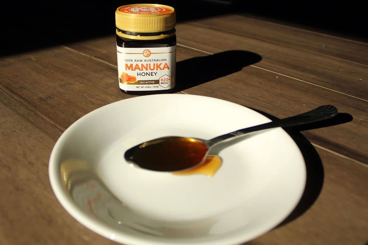 A serving of manuka honey placed in a spoon. 