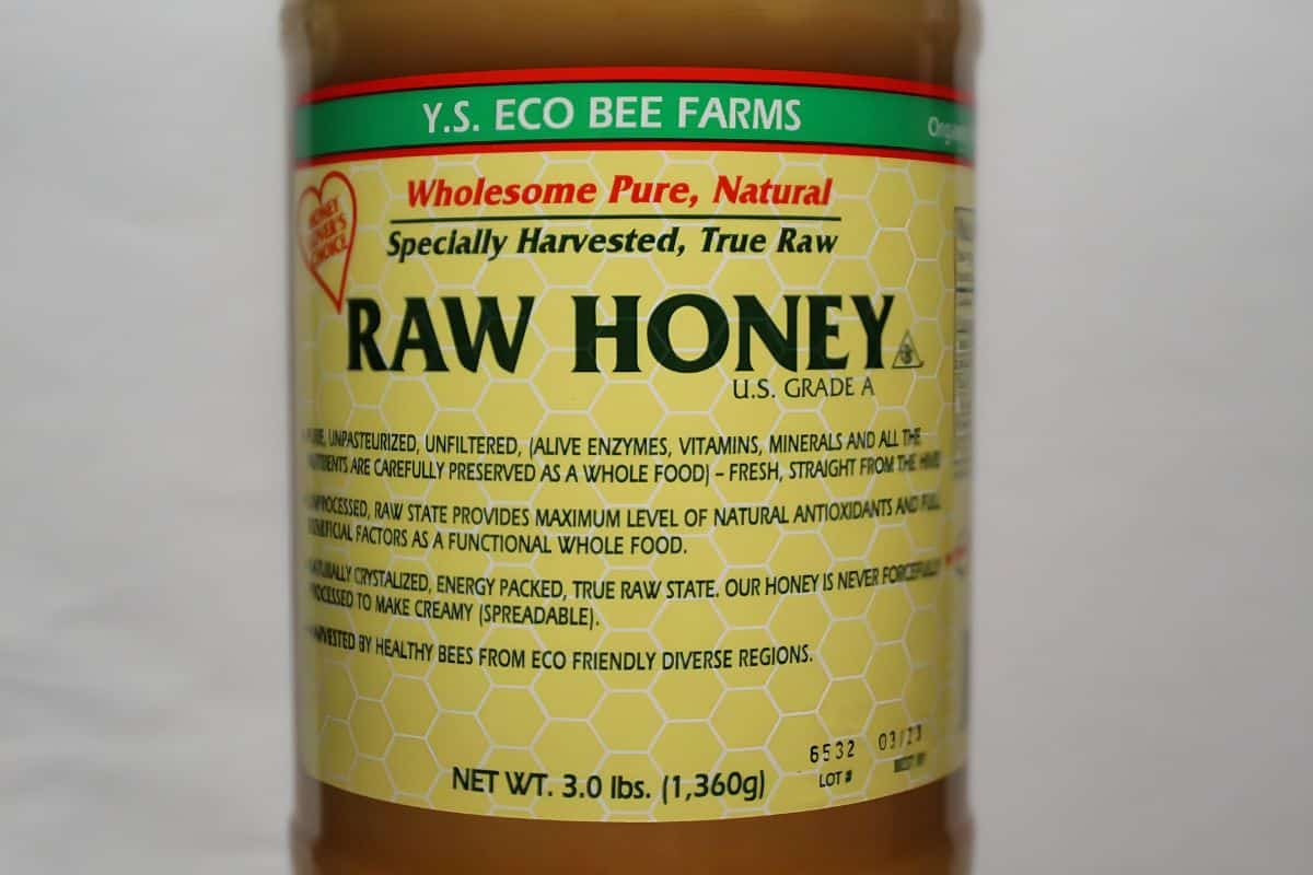 A bottle of Eco Bee Farms Raw Honey.