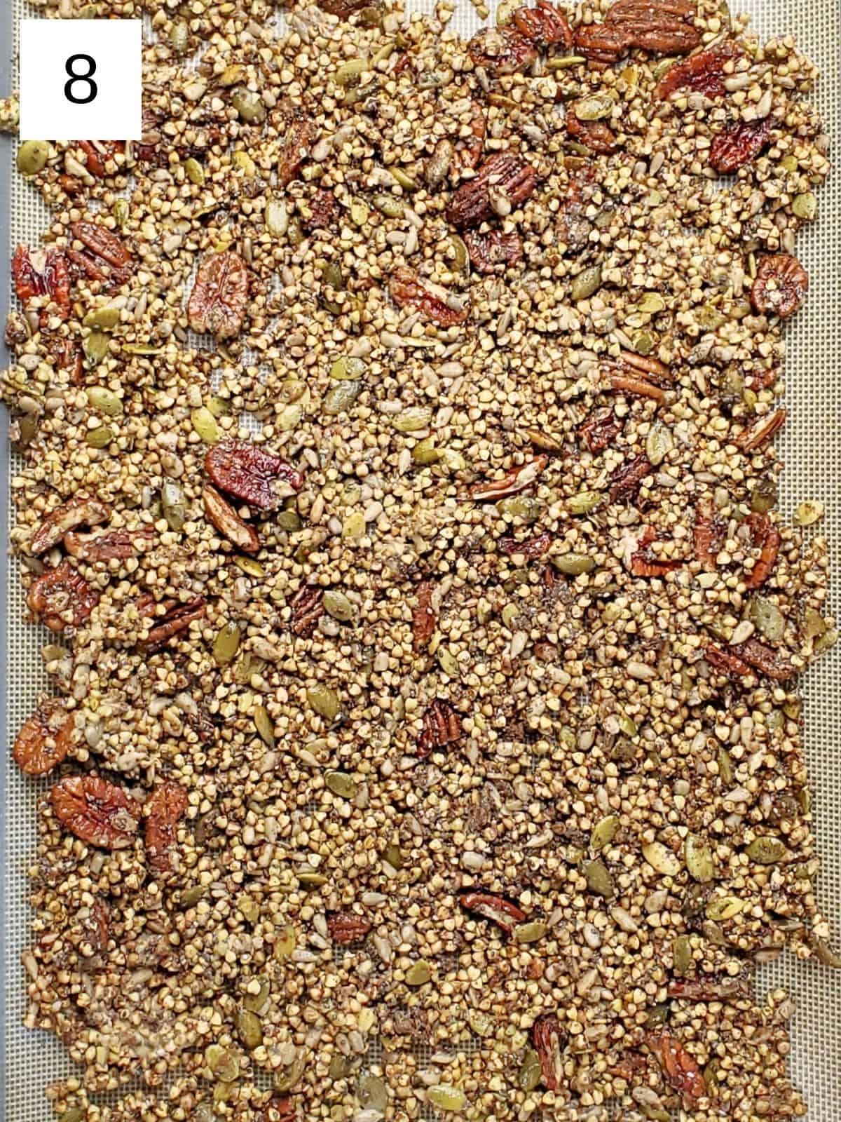 Granola nuts mixture on a baking tray.