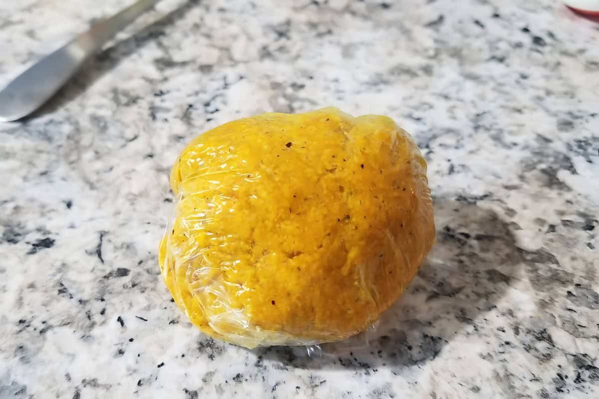 A ball of turmeric paste for freezing.