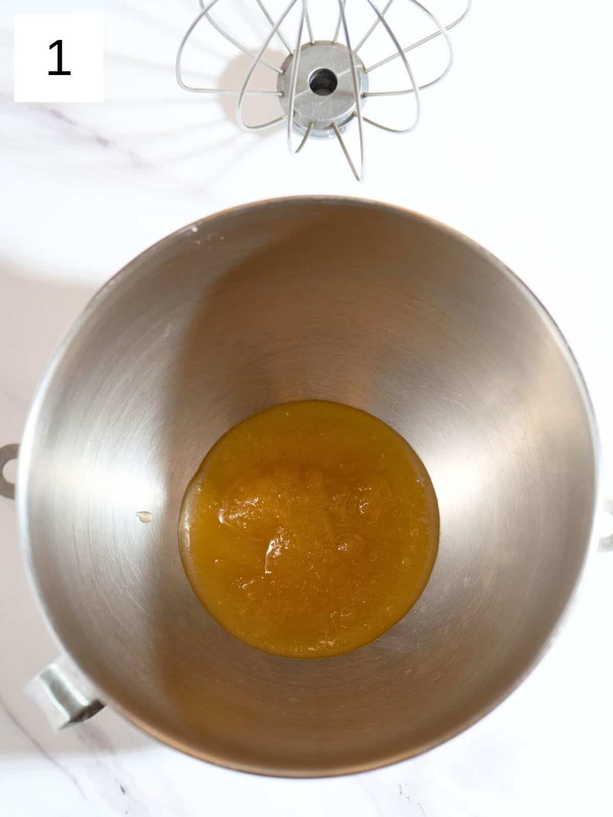 Honey placed in a stainless steel bowl.