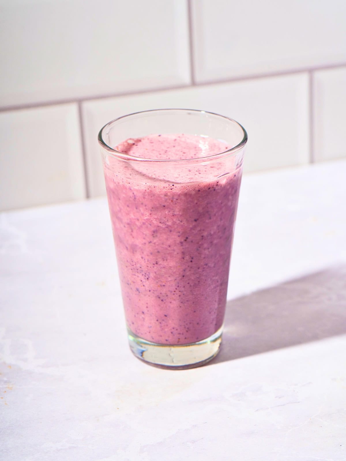 Refreshing blueberry cucumber smoothie served in a glass