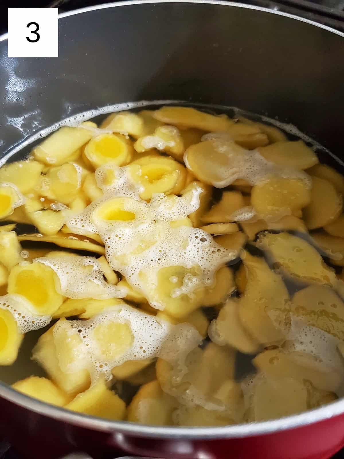 a mixture of ginger, water, and sweeteners in a pot.