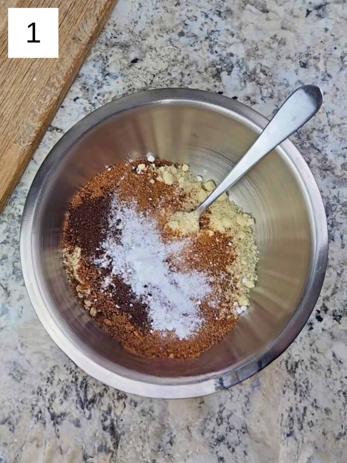 A mixture of all the dry ingredients for vanilla almond cookies, including almond flour, baking powder, coconut sugar, monk fruit powder, and monk fruit powder.