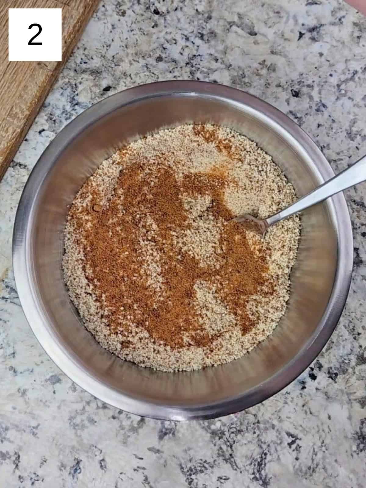 A mixture of all the dry ingredients for vanilla almond cookies, including almond flour, baking powder, coconut sugar, monk fruit powder, and monk fruit powder.