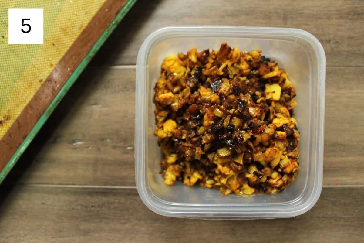 Crispy baked cauliflower in a plastic container, showcasing a delicious and healthy snack option.