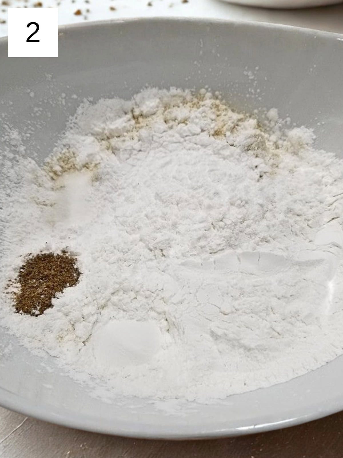 A mixture of dry ingredients for cardamom cookies.