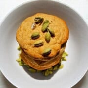 A stack of honey cardamom cookies on a plate.