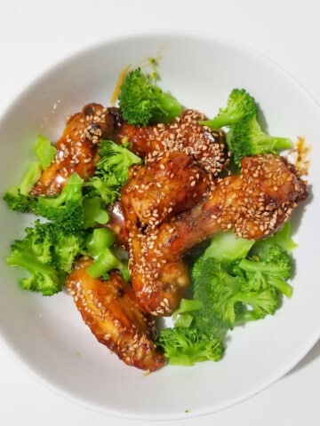 air fried honey garlic chicken wings with broccoli.