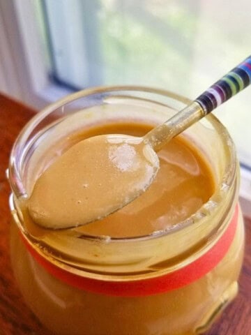 toasted macadamia nut butter in a glass jar.