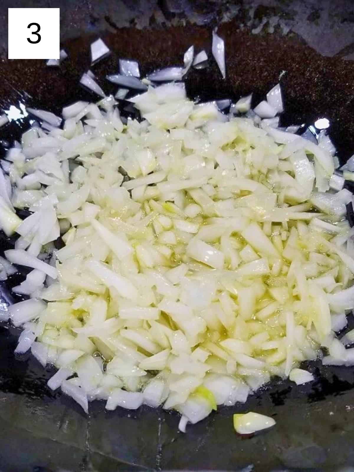 Chopped onions in a pre-heated pan.