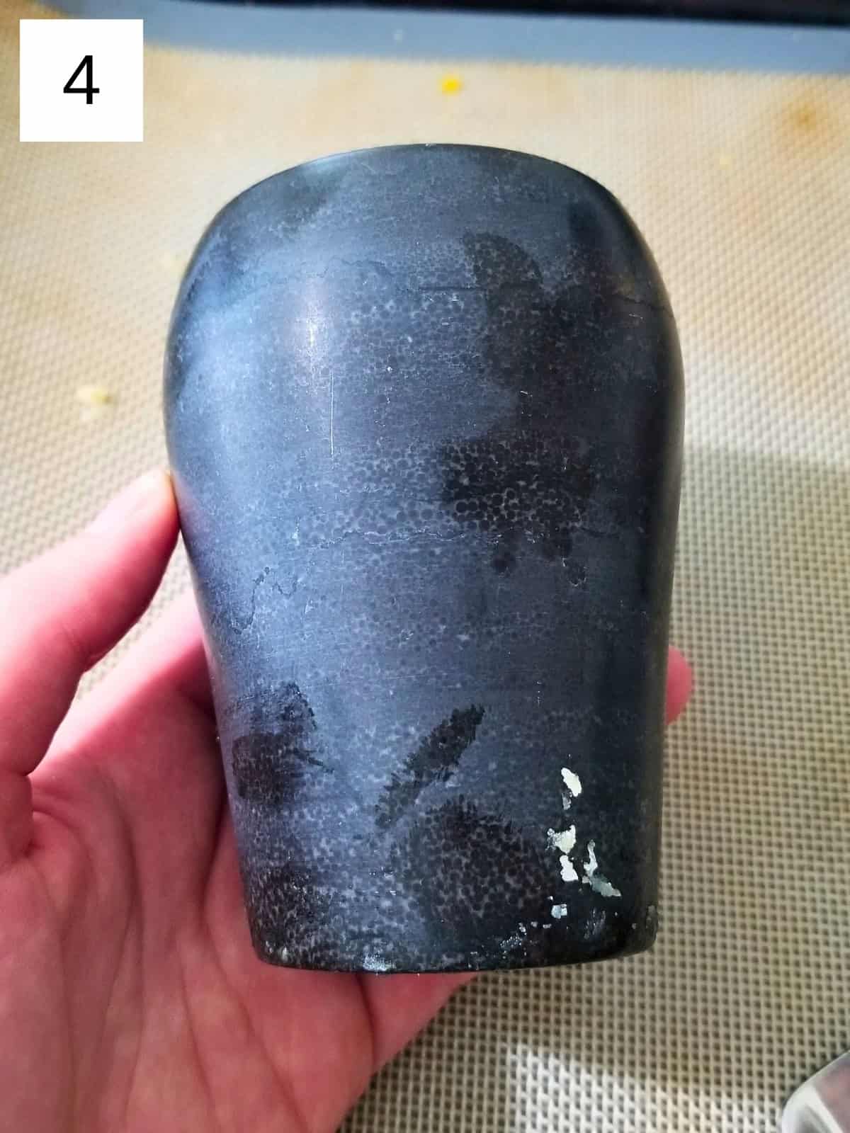 A heavy tool for smashing the potatoes.